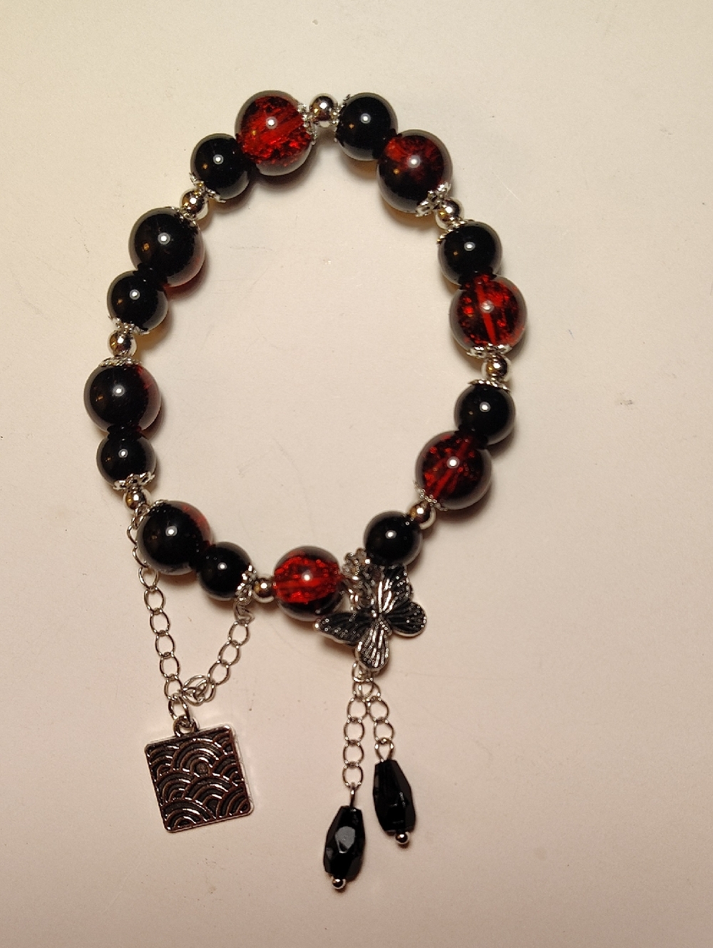 Handmade Black and Red Beaded Bracelet with Butterfly Charm